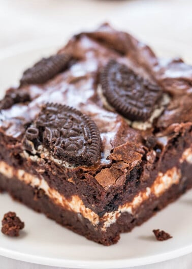 A piece of oreo cookie brownie on a white plate.