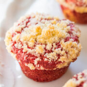 Red velvet muffin topped with crumb streusel.