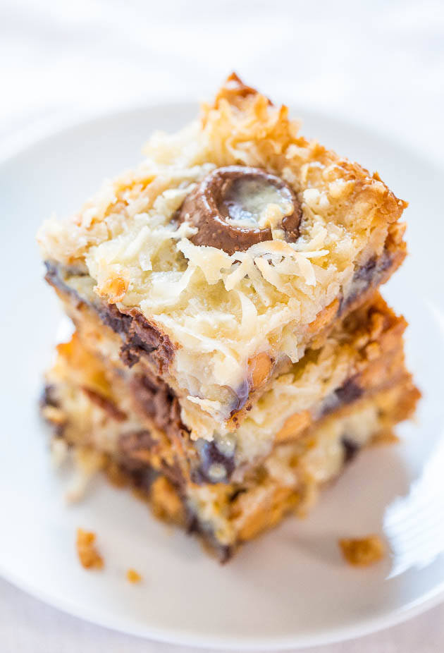 7 Layer Bars — These 7 layer bars have a graham cracker crust that's topped with semi-sweet chocolate chips, butterscotch chips, coconut, sweetened condensed milk, and melted caramely Rolos.
