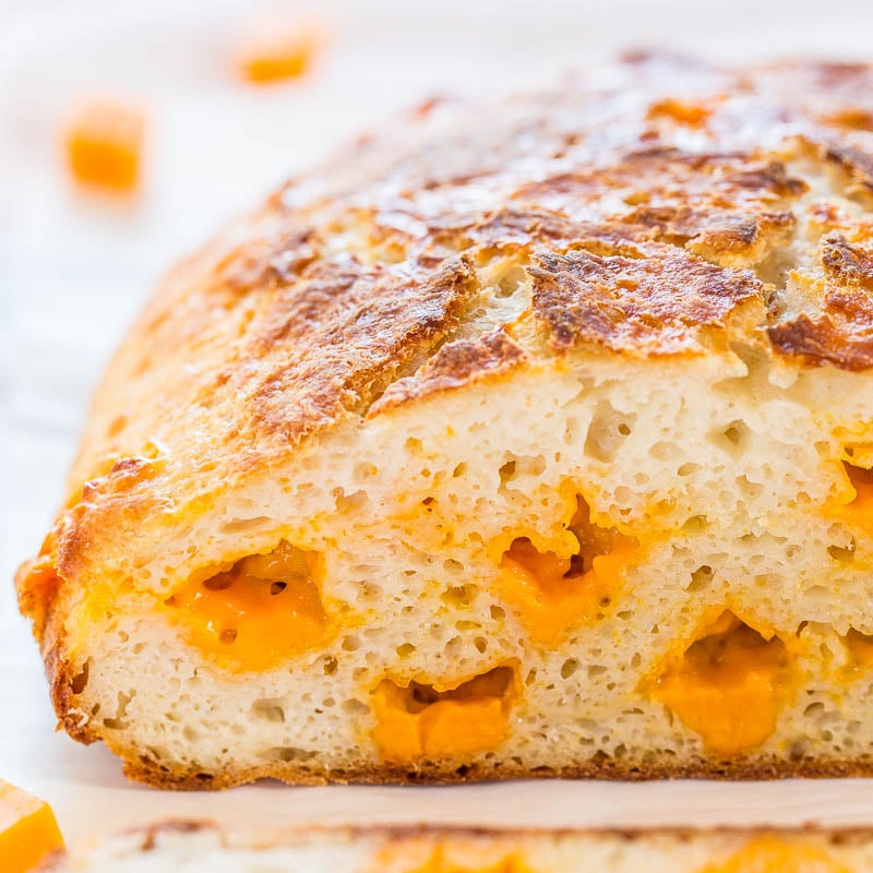 Loaf of cheese bread with visible chunks of melted cheese.