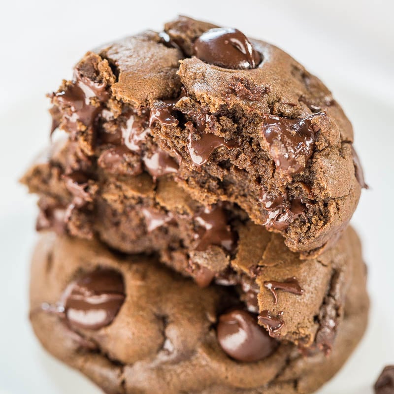 A stack of gooey chocolate chip cookies.