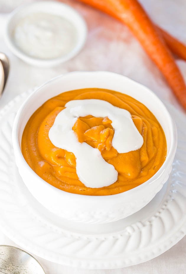 Skinny Carrot Potato Soup with Honey Cream - Healthy, hearty, fast, and easy! Packed with flavor and you'll never miss the fat and calories!