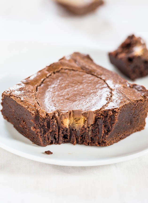 Fudgy Peanut Butter Cup Brownies - Easy, one-bowl, no mixer brownies with a full-size PB cup in every brownie! As fast as using mix and tastes way better!!