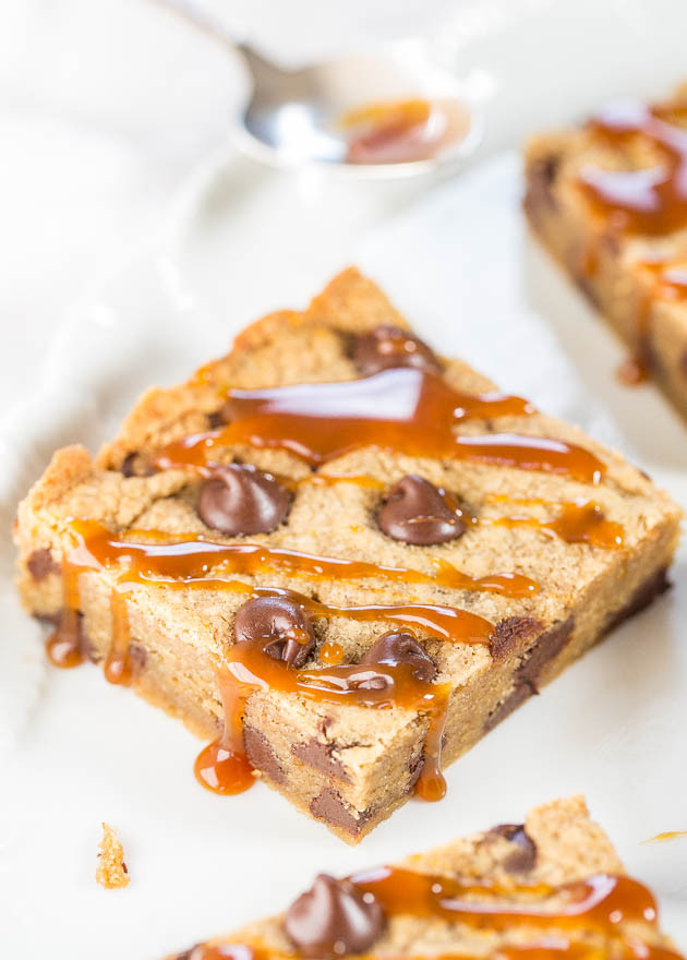 Salted Caramel Peanut Butter Chocolate Chip Bars - Made with salted caramel PB (yes it's a thing!) Soft, chewy, gooey and so irresistible!!!