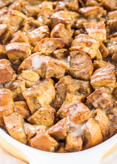 A dish of freshly baked cinnamon monkey bread with glaze.