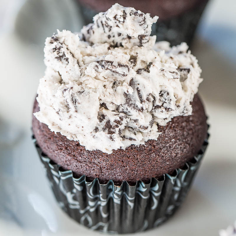 A chocolate cupcake topped with cookies and cream frosting.