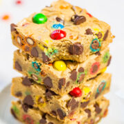 A stack of colorful candy-studded blondies.
