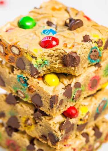 A stack of colorful candy-studded blondies.