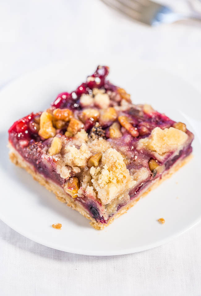 Berry Crumble Bars - Big buttery crumbles top the soft, juicy bars packed with blueberries, raspberries and strawberries! Easy, no mixer recipe that's irresistible!! (Frozen fruit okay!)