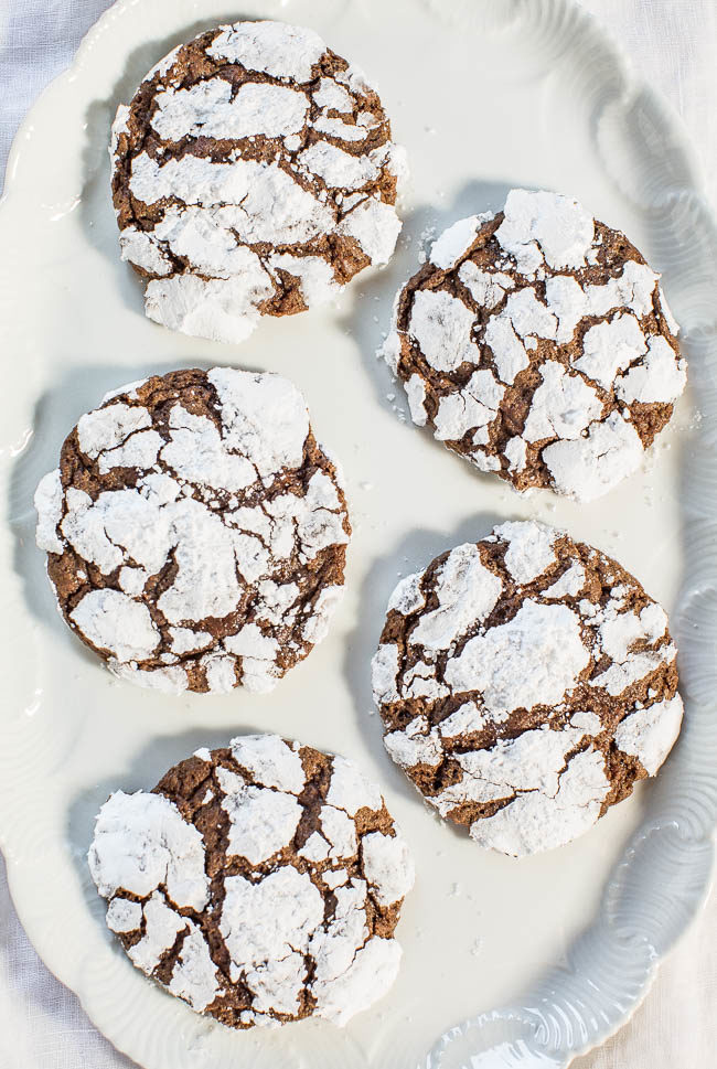 Chocolate Crinkle Cookies - Soft, ultra fudgy and there's NO butter and NO mixer needed! So easy and the crinkles make them irresistible!! Break them apart at the crinkly seams and start nibbling!!