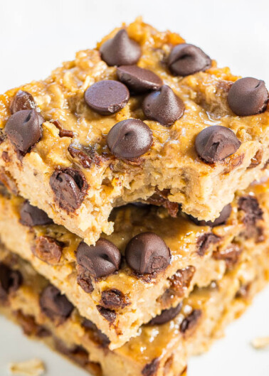 Stack of chocolate chip blondies on a plate.