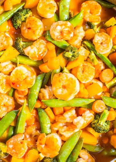 Stir-fried shrimp and mixed vegetables in a pan.