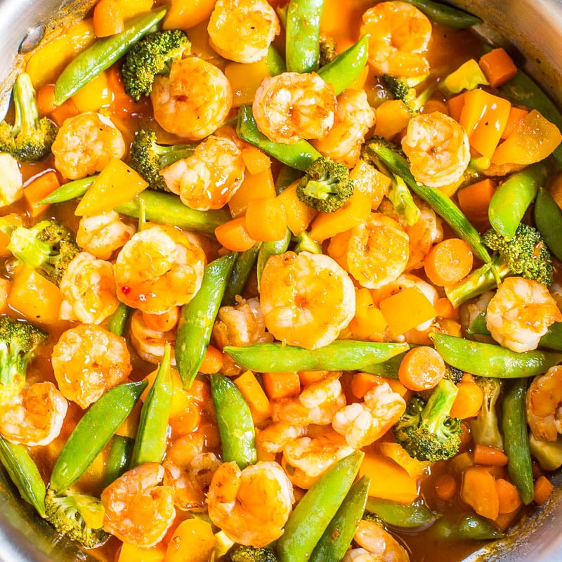 Stir-fried shrimp and mixed vegetables in a pan.