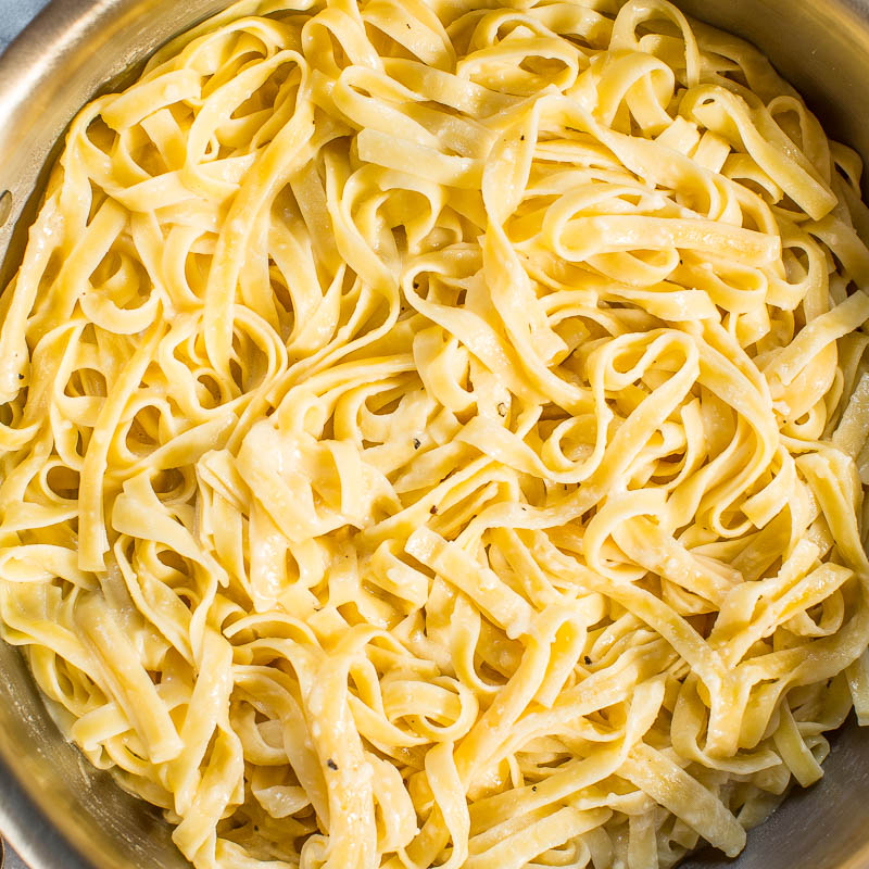 Cooked fettuccine pasta in a pot.