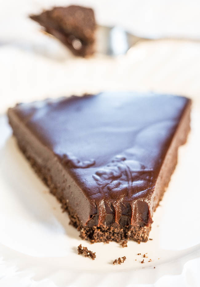 Chocolate Honey Almond Tart - A creamy, silky, smooth no-bake chocolate and honey filling over a chocolate graham cracker crust! Chocoholics: This easy, rich, and decadent tart will tame your fiercest cravings!!
