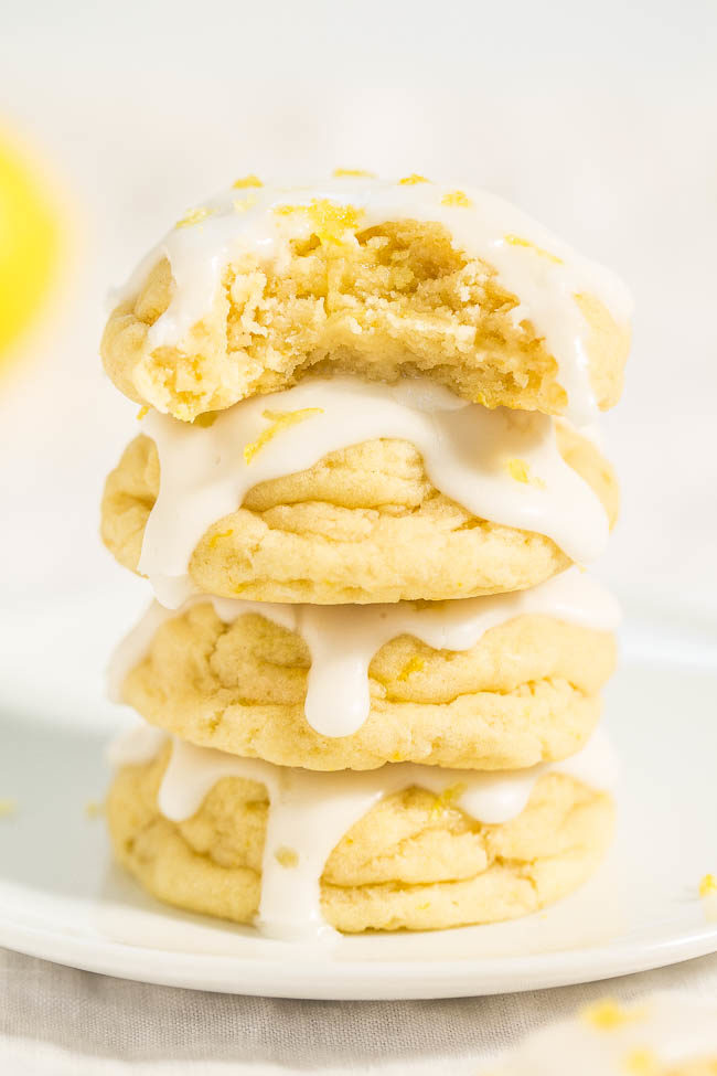 Stacked Softbatch Glazed Lemon Cream Cheese Cookies with bite taken out of one