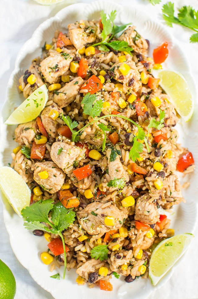 Lime Cilantro Chicken with Rice and Beans on white platter with lime wedges - Instant Pot Black Beans