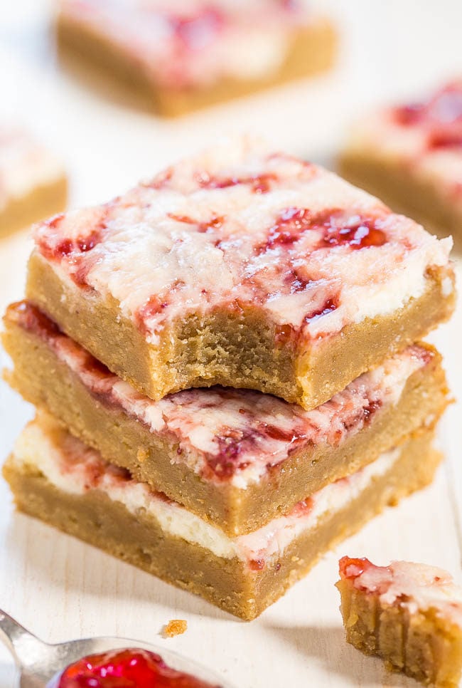 Strawberry Cheesecake Bars - Soft, buttery bars topped with cheesecake and swirled with strawberry jam! The best of all worlds in these fast, easy, and AMAZING bars!!