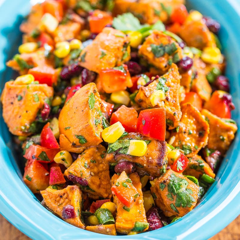 Roasted Sweet Potato Salad — This roasted sweet potato salad is tossed in a honey Dijon dressing. The sweet and savory flavors of this potato salad are to die for complete with red bell peppers, black beans, corn, cilantro, and tossed in a lemon Dijon light dressing!