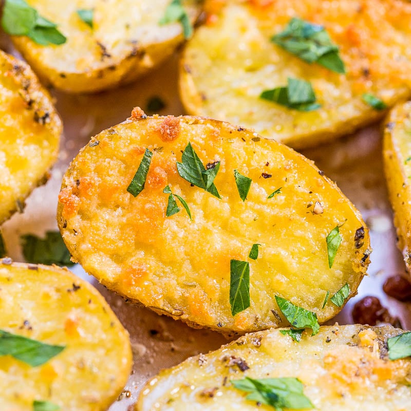 Roasted potato halves garnished with herbs.