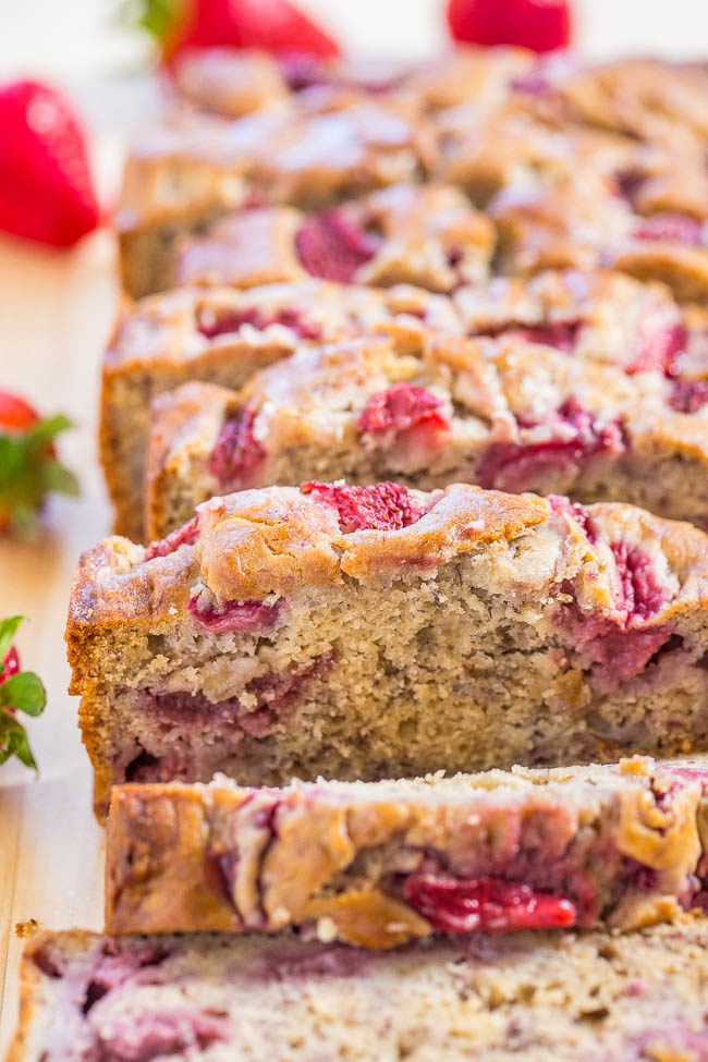 The Best Strawberry Banana Bread - Super soft, moist bread with tons of juicy strawberries! Easy, no-mixer recipe, and THE BEST use for ripe bananas!!