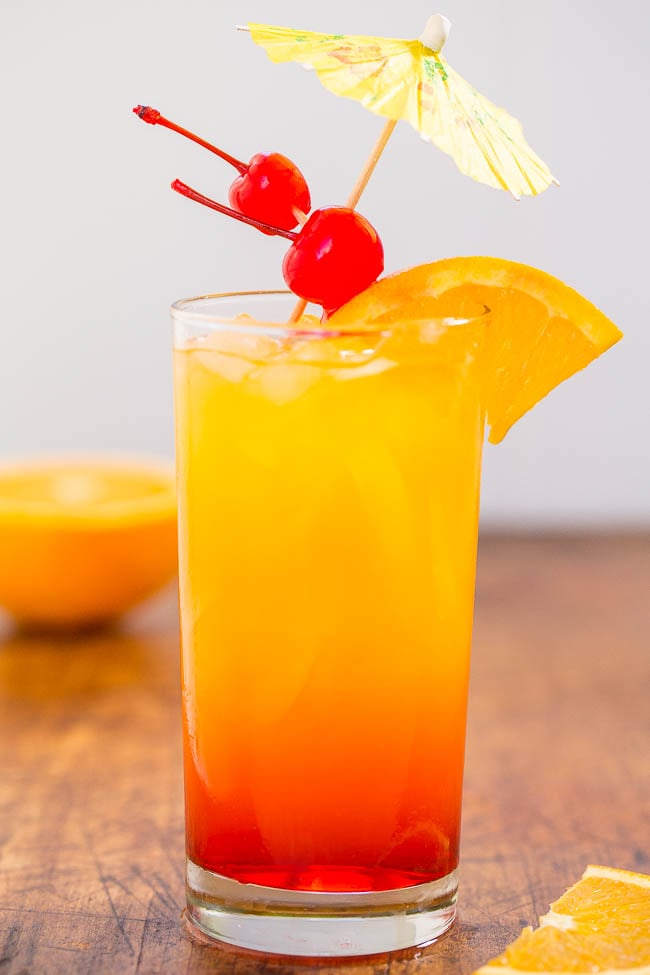 Tequila Sunrise — Not only is it pretty to look at, but a tequila sunrise is also refreshing, nostalgic, and the grenadine sweetens it up enough that you may not even notice it packs quite a punch!
