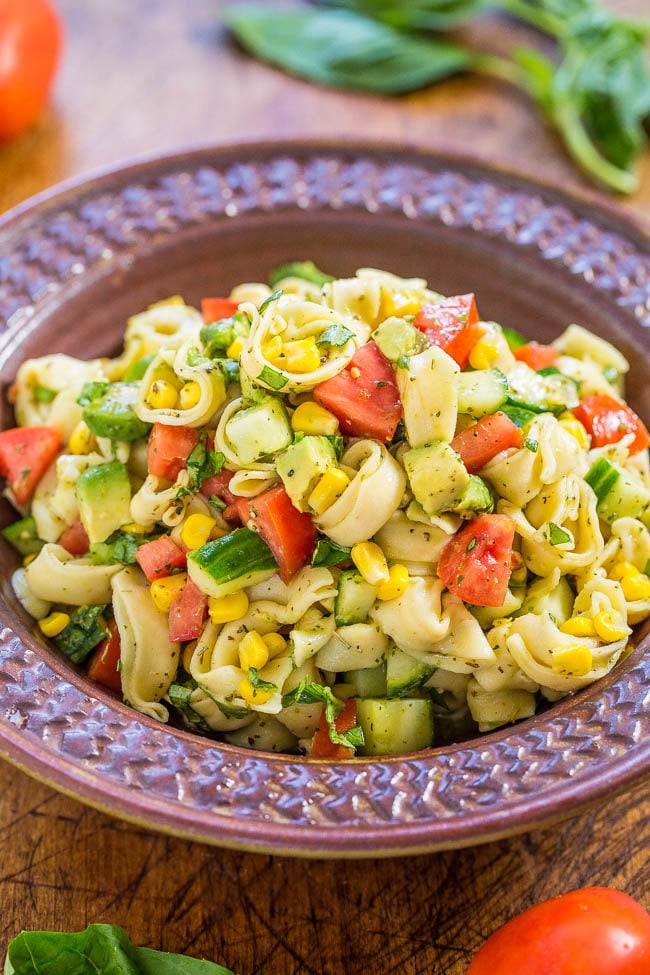 Garden Fresh Tortellini Pasta Salad - Juicy tomatoes, cucumbers and corn with creamy avocado, basil and parmesan tossed in lemon vinaigrette with cheese tortellini!! Healthy, easy, ready in 15 minutes!