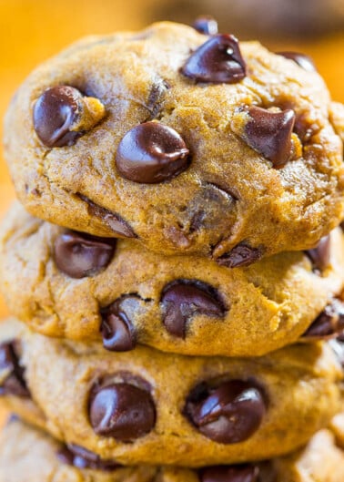 A stack of freshly baked chocolate chip cookies.