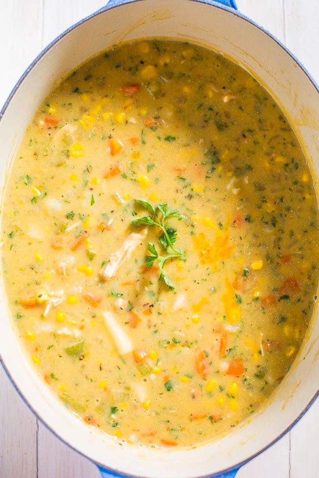 Loaded Cheesy Chicken Potato Chowder - Potatoes, chicken, carrots, corn and more!! Thick, creamy, rich, and wonderfully cheesy!! Fast and easy comfort food that everyone loves!!