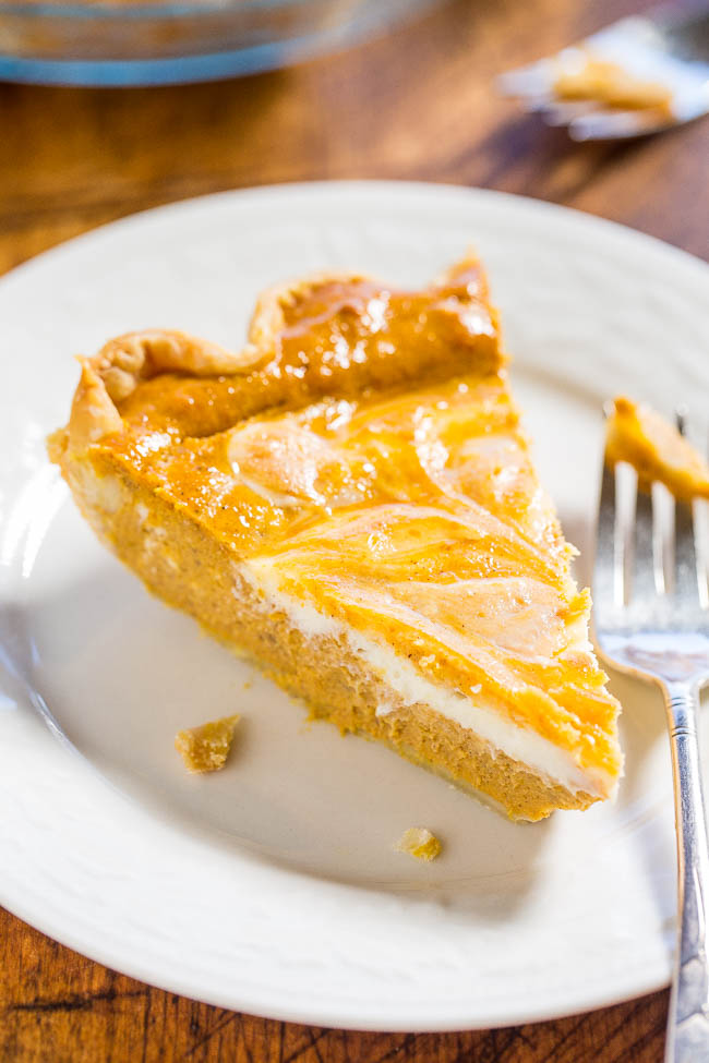 Pumpkin Cream Cheese Pie - Cream cheese is in the filling AND swirled on top!! A huge step up from regular pumpkin pie!! Easy, so good, and a big hit with everyone!!