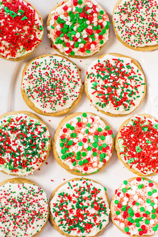 Soft Frosted Holiday Sprinkles Cookies - Tender, buttery cookies topped with cream cheese frosting and loaded with sprinkles!! Easy, no-roll holiday cookies that everyone goes crazy for!!