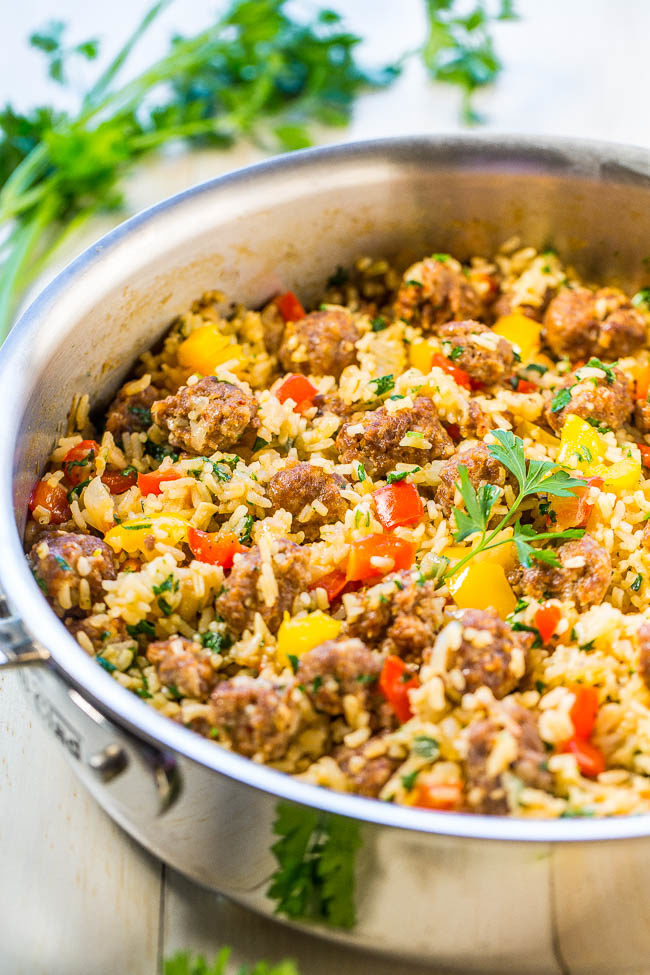 Easy One-Skillet Sausage and Peppers with Rice - Juicy sausage, crisp peppers, onions, and rice all cook together in one skillet! Makes cleanup a breeze! Packed with flavor and ready in 30 minutes!!