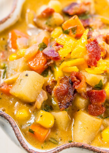 Hearty vegetable and bacon stew served in a decorative dish.