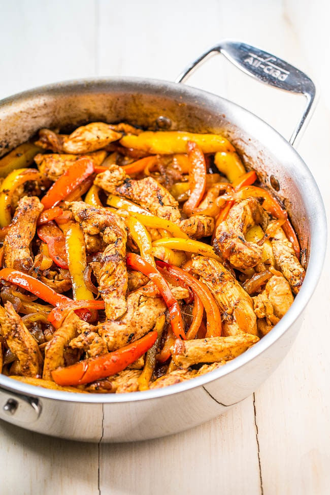 Easy 30-Minute Chicken Fajitas - Make restaurant-style fajitas at home in just 30 minutes!! Juicy chicken, caramelized onions, and bell peppers pack so much flavor! This easy recipe will go into your regular rotation!!