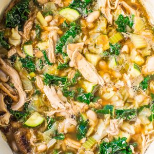 A pot of homemade chicken and vegetable soup.