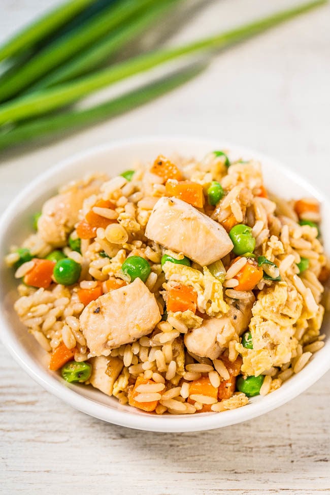 Easy Better-Than-Takeout Chicken Fried Rice - One-skillet, ready in 20 minutes, and you'll never want takeout again after tasting how good homemade is!! Way more flavor, not greasy, and loads of juicy chicken!!