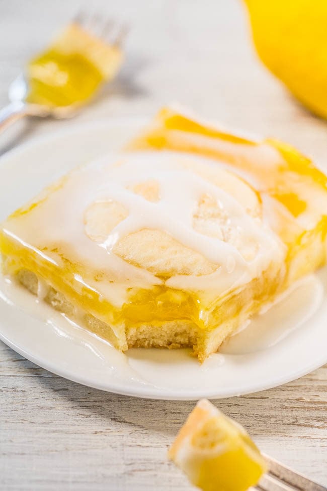 Glazed Lemon Pie Bars - Buttery soft crust with luscious lemon filling and a lemon glaze boosts the bold lemon flavor even more!! If you like lemon pie, you'll love these easy bars that are so much easier than making pie!!