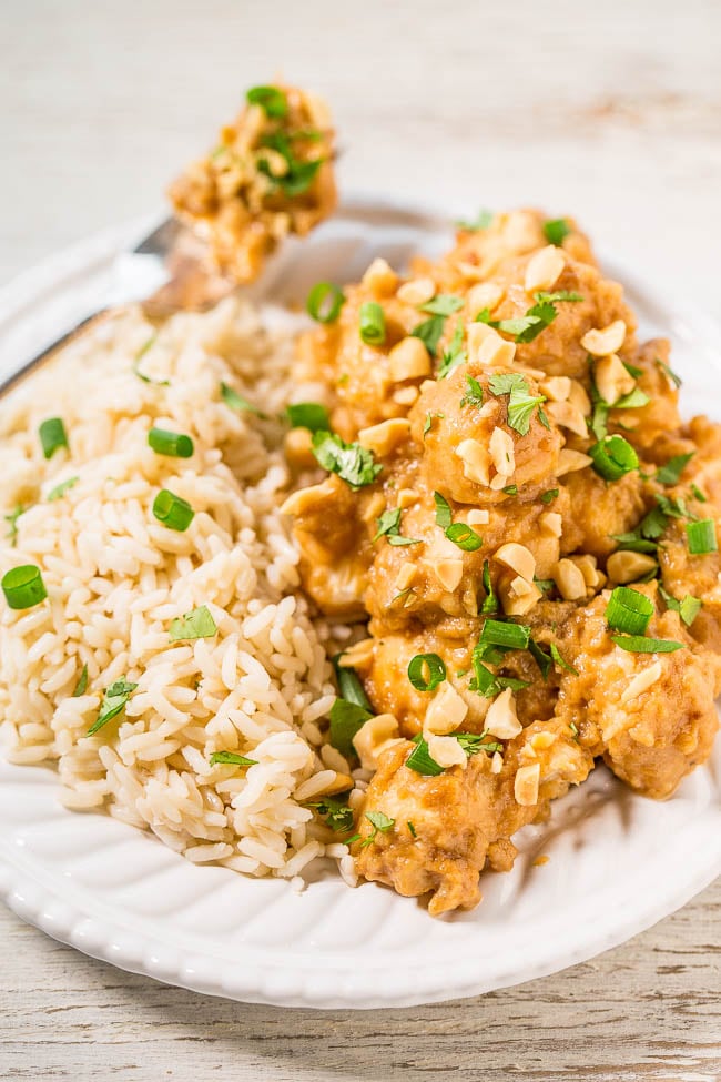 Thai Peanut Chicken on bed of rice with fork