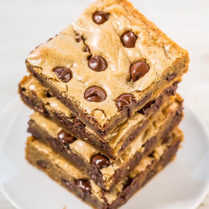 A stack of chocolate chip blondies on a plate.