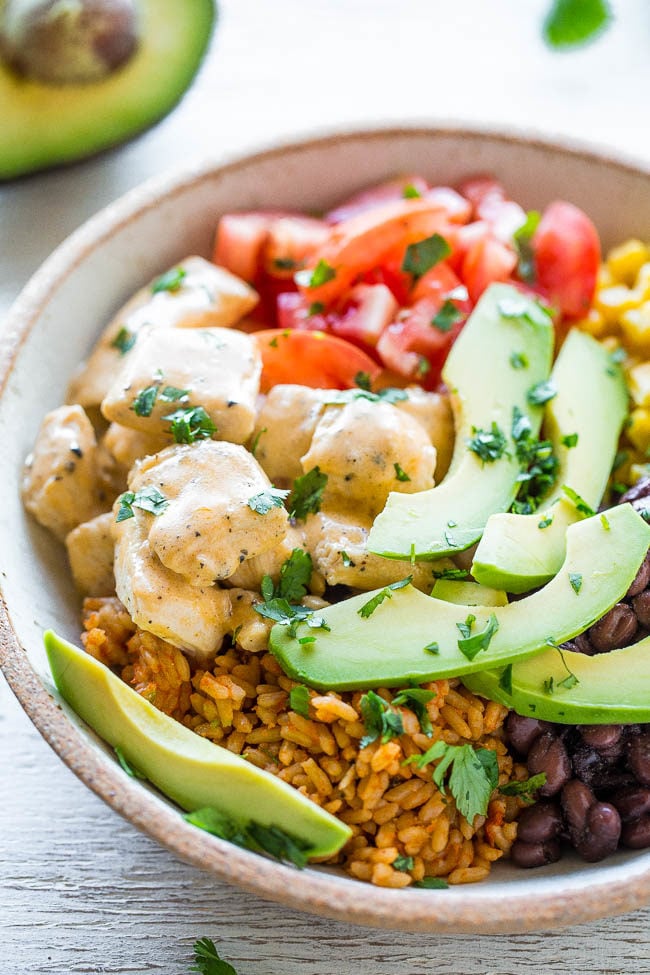Buffalo Chicken Burrito Bowls - Juicy chicken along with your favorite burrito ingredients served in a bowl!! Pile the toppings sky high and not worry about a wrap breaking, plus it's a little healthier!! Easy and ready in 15 minutes!!