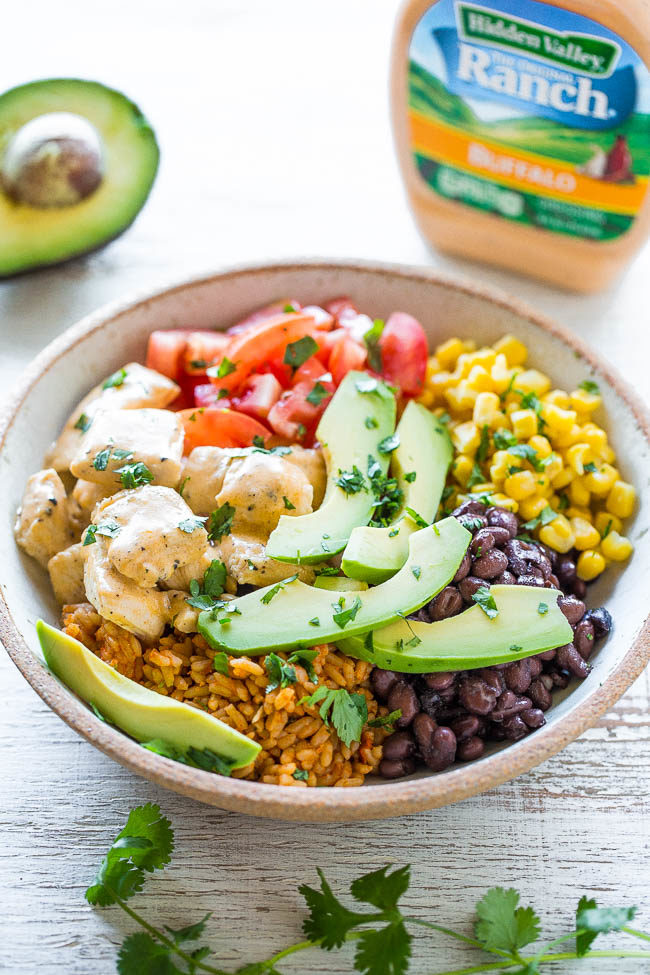 Buffalo Chicken Burrito Bowls - Juicy chicken along with your favorite burrito ingredients served in a bowl!! Pile the toppings sky high and not worry about a wrap breaking, plus it's a little healthier!! Easy and ready in 15 minutes!!