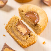 A peanut butter cookie with a molten chocolate center, cut in half to reveal the filling.