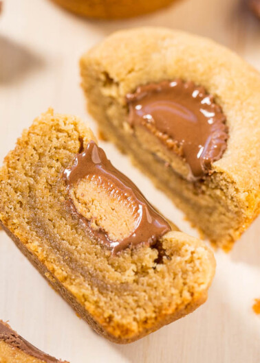 A peanut butter cookie with a molten chocolate center, cut in half to reveal the filling.