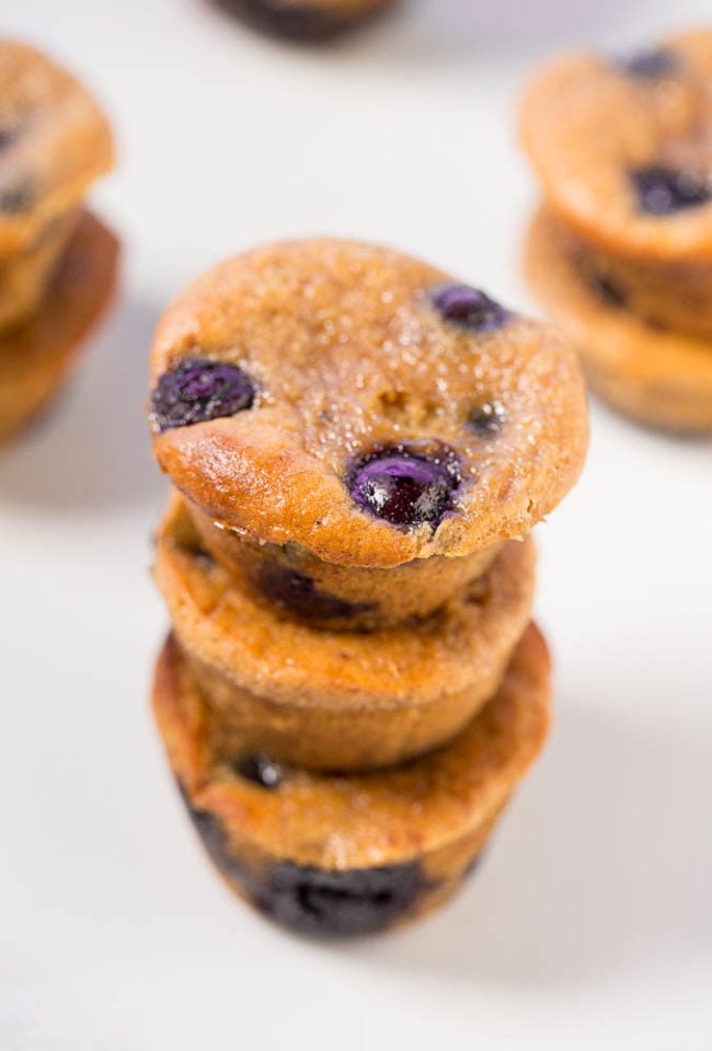 Three stacked Flourless Blueberry Banana Blender Muffins