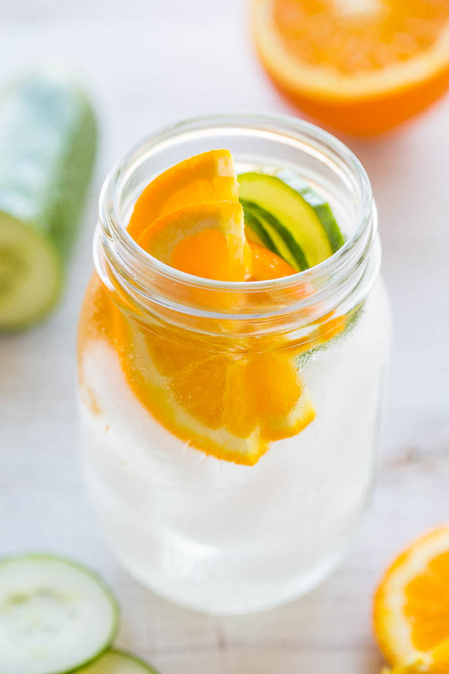 orange cucumber water in glass jar