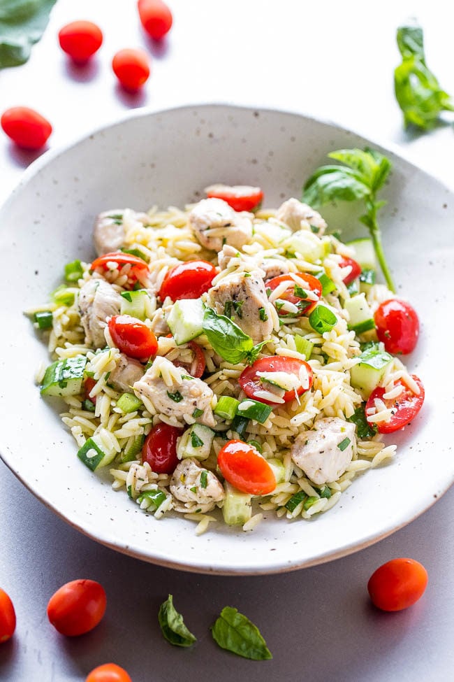 Orzo Chicken Salad - Juicy chicken tossed with orzo, tomatoes, cucumbers, basil, and a super flavorful lemon vinaigrette!! Easy, healthy, ready in 30 minutes, and a perfect way to use your garden fresh veggies!!