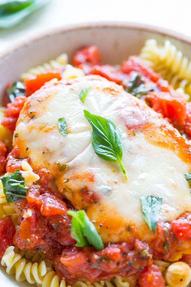 Tomato, Basil, and Mozzarella Chicken - A healthier twist on chicken parmesan because there's NO breaded chicken!! Easy, ready in 20 minutes, and loaded with FLAVOR! A guaranteed hit that'll be in your regular dinner rotation!!