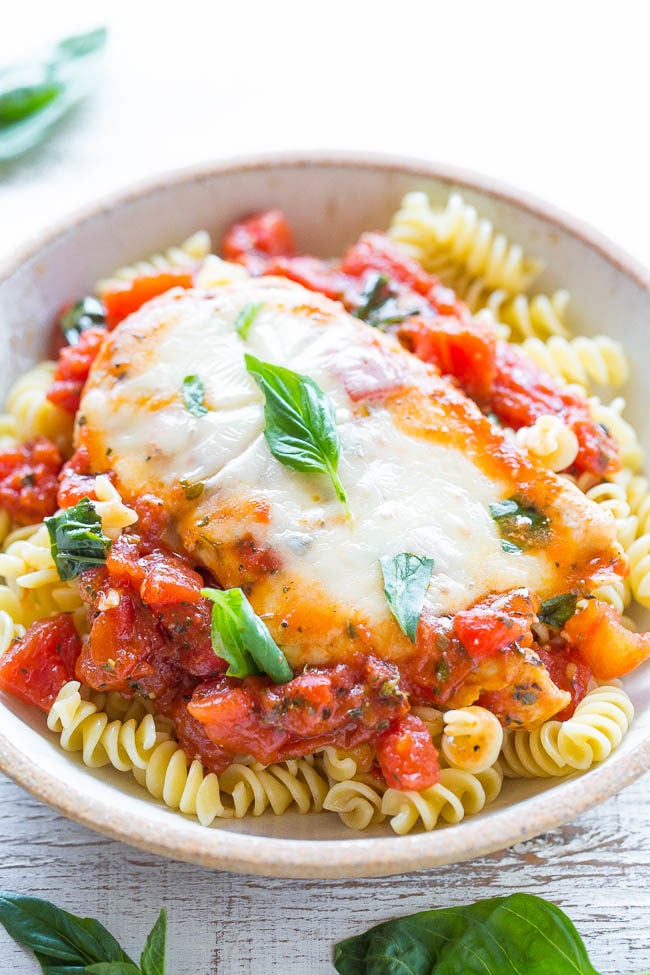 Tomato, Basil, and Mozzarella Chicken - A healthier twist on chicken parmesan because there's NO breaded chicken!! Easy, ready in 20 minutes, and loaded with FLAVOR! A guaranteed hit that'll be in your regular dinner rotation!!