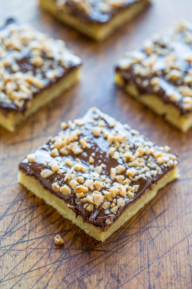 Toffee Almond Bars - An ultra BUTTERY base made with almond extract and topped with CHOCOLATE and TOFFEE BITS!! An easy dessert that's ready in 15 minutes but tastes like you slaved over it!!