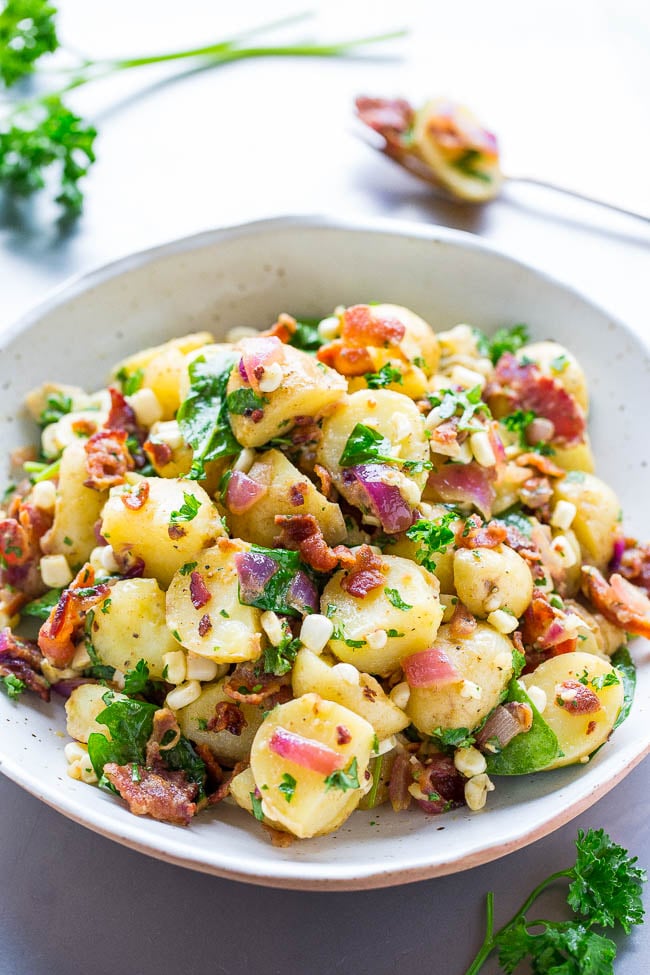 potato salad with bacon in a large serving bowl